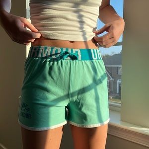 Teal Colored Under Armour athletic shorts.